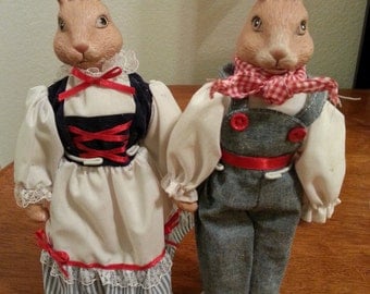 Man and Woman Dutch Rabbits on stands