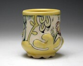 Yellow Cup with Embossed Relief and Floral Illustrations