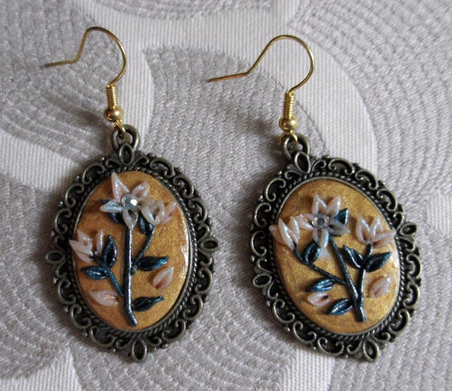 Polymer clay earrings, handmade with small flowers in white and green color. Metal base in antique bronze color.