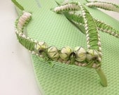 Green and beige macrame ribbon flip flop with embelishments
