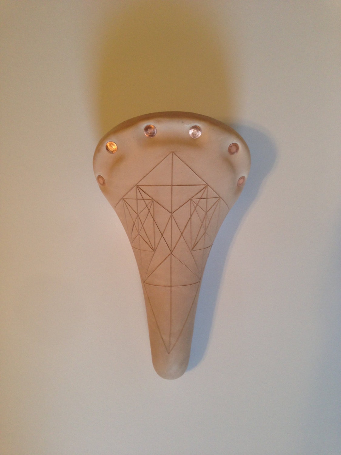 Geometric leather bicycle seat w/ natural finish