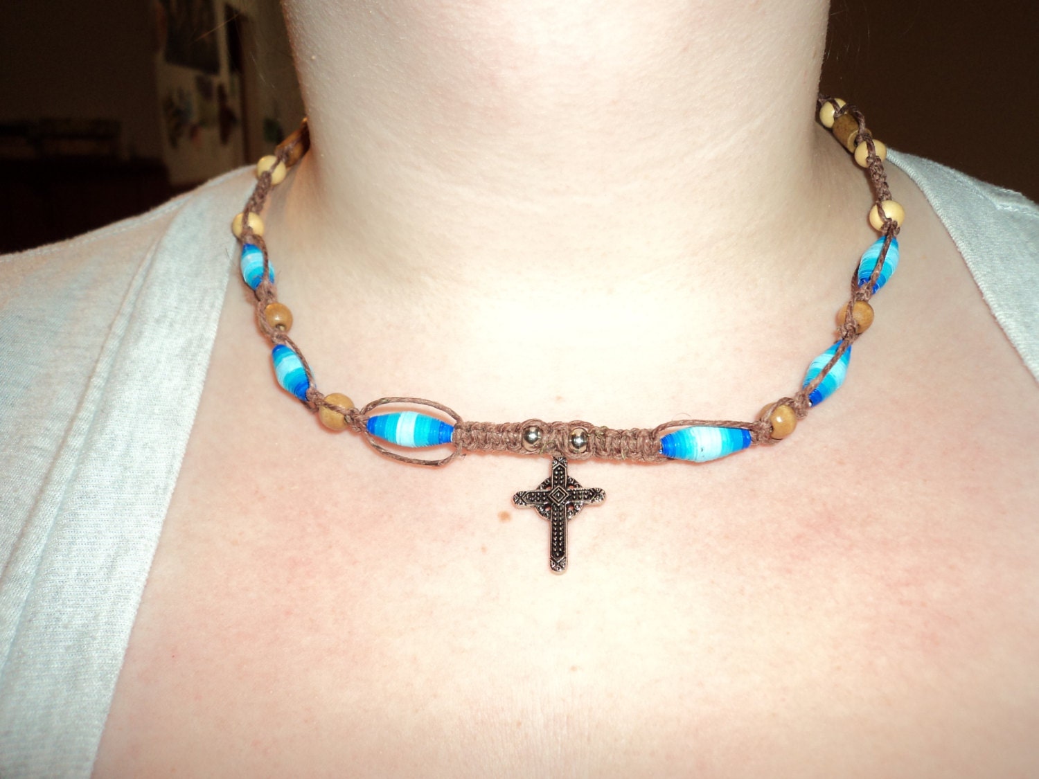 Long brown hemp natural looking necklace with handmade blue beads and cross in the center