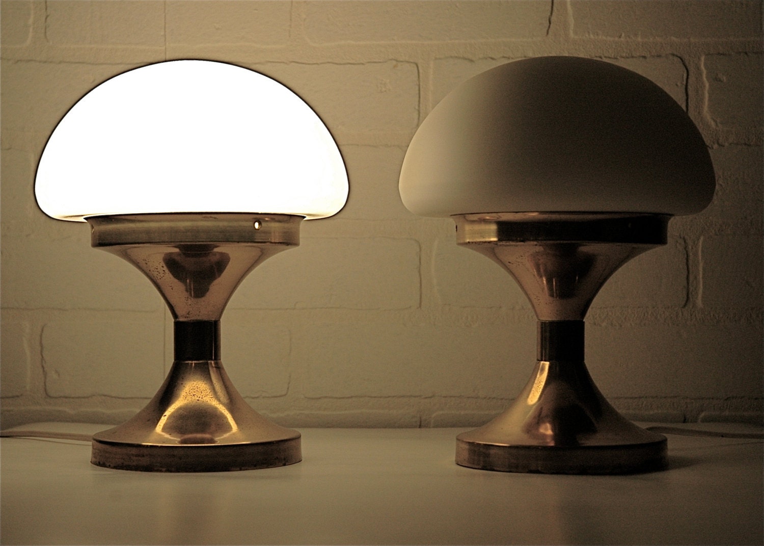 Pair of mid century brass and milk glass table lamps