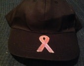 One size fits most black cap with pink sequin breast cancer awareness ribbon