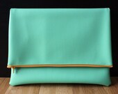 Mint green all vegan leather clutch with pumpkin orange zipper