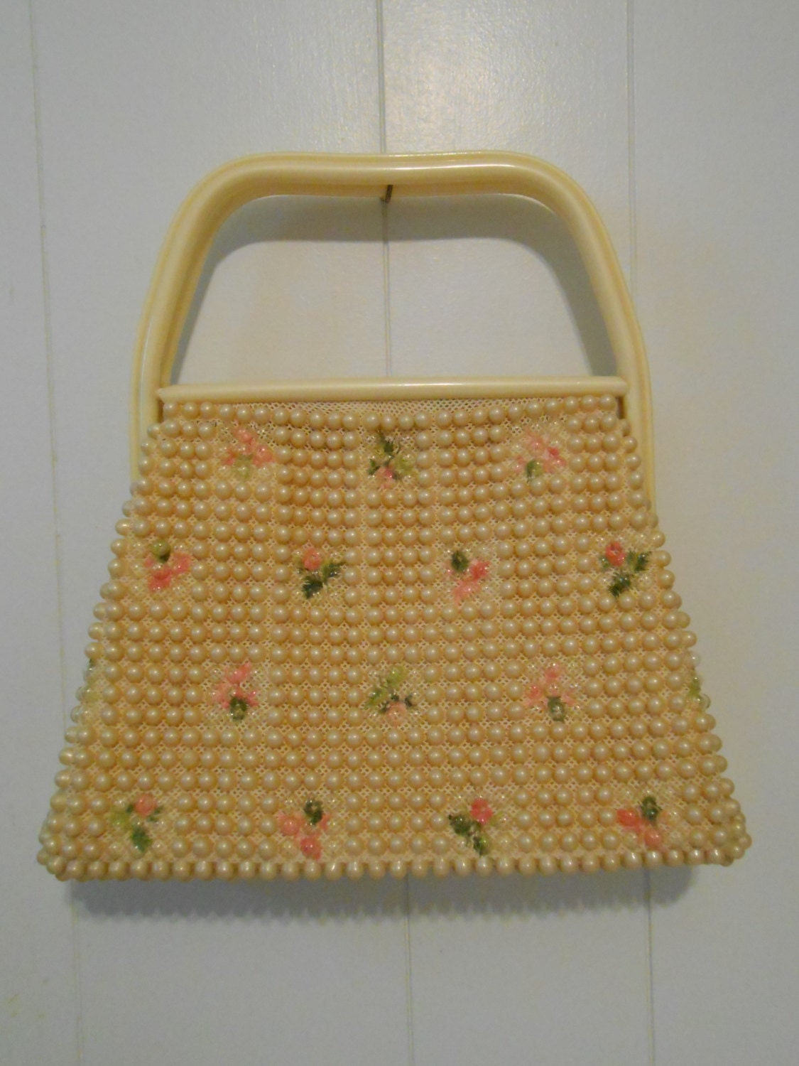 Vintage 1960's early 1970's light beige beaded hand bag purse with floral pattern and beige celluloid handles and frame