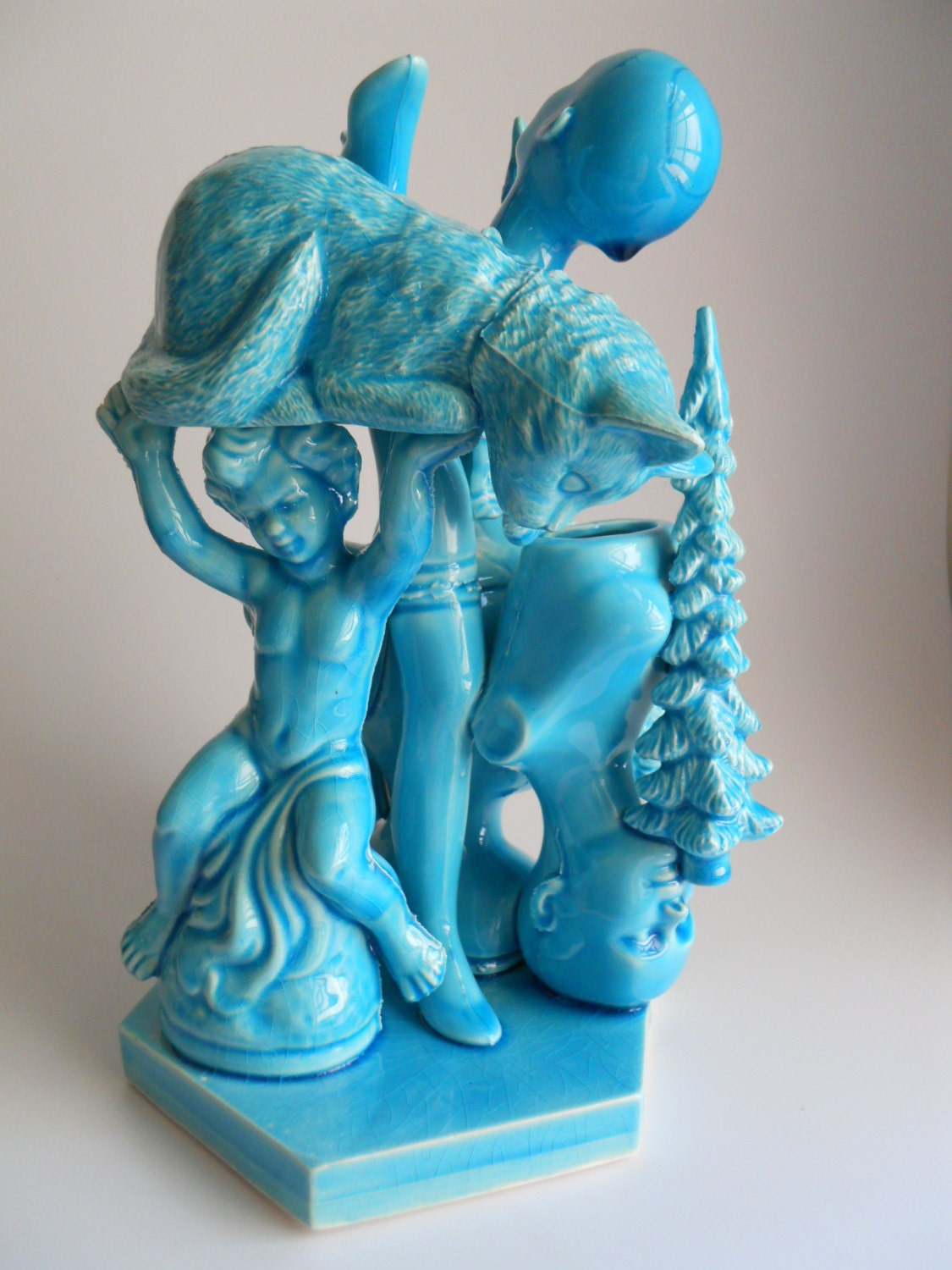 Very Bright Blue Vessel of dolls, cats, trees, and gnomes