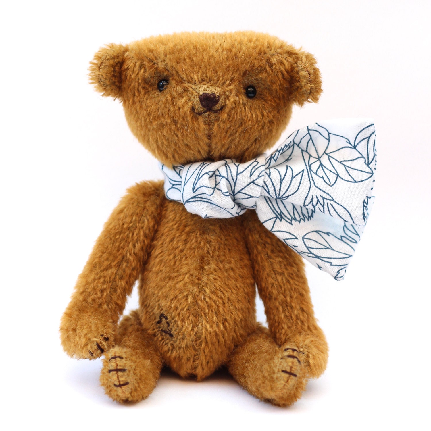 Max the little brown jointed teddy bear with neck scarf