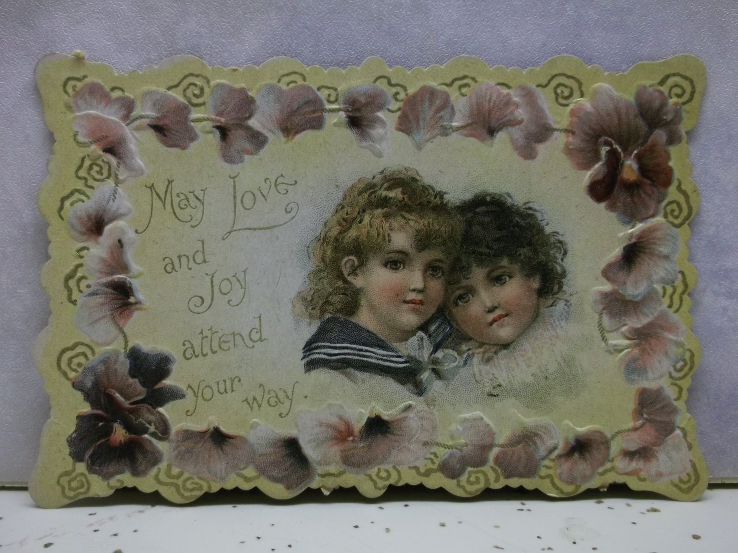 2 Curly Haired Girls with Purple Pansies- Embossed Die Cut Valentine - early 1900's