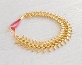 Fishbone Matte Gold Bracelet with Pink Leather Clasp