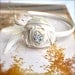 Warm Vanilla Sugar Rose Headband. Glamourous cream silk accented with crystal rhinestones. fawn feathers and gold french netting.