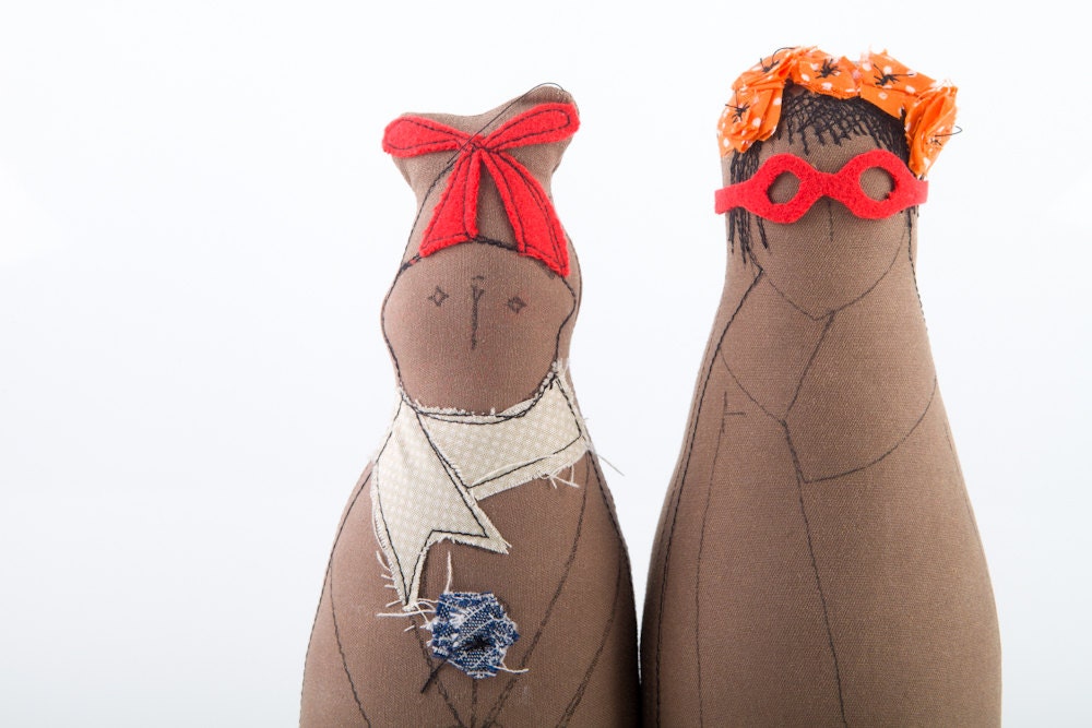 Mother and son - She in dotted skirt , red glasses orange hair flowers . he wearing  hat , scarf holding a flower - handmade fabric doll