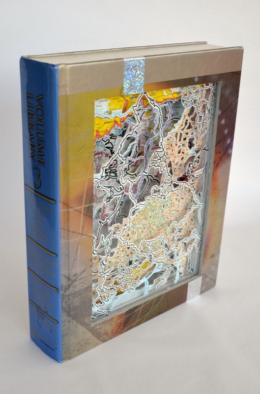 Book carving: "Volume Library Maps"