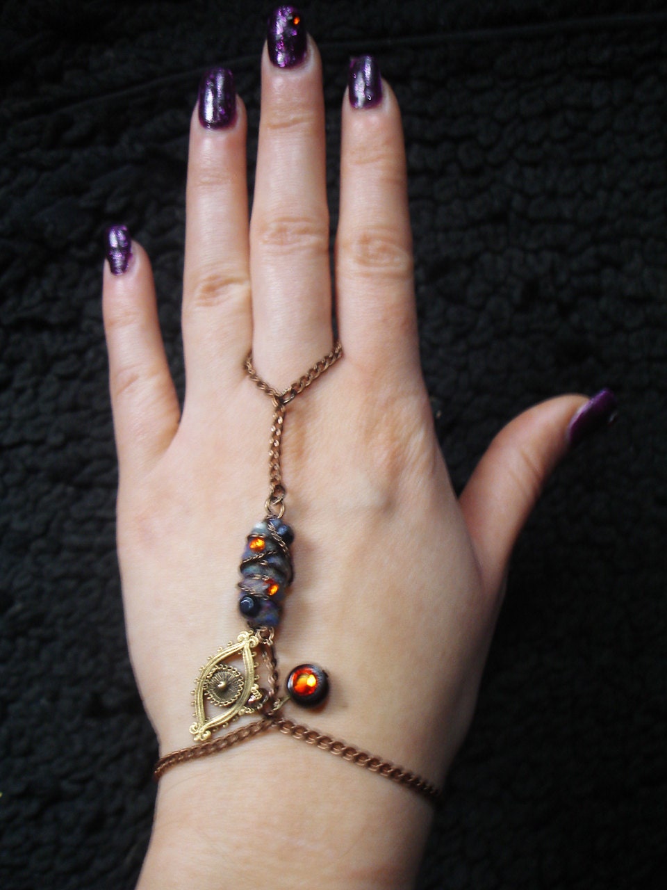 Unique copper slave chain bracelet with handmade fiber bead and ornate evil eye charm