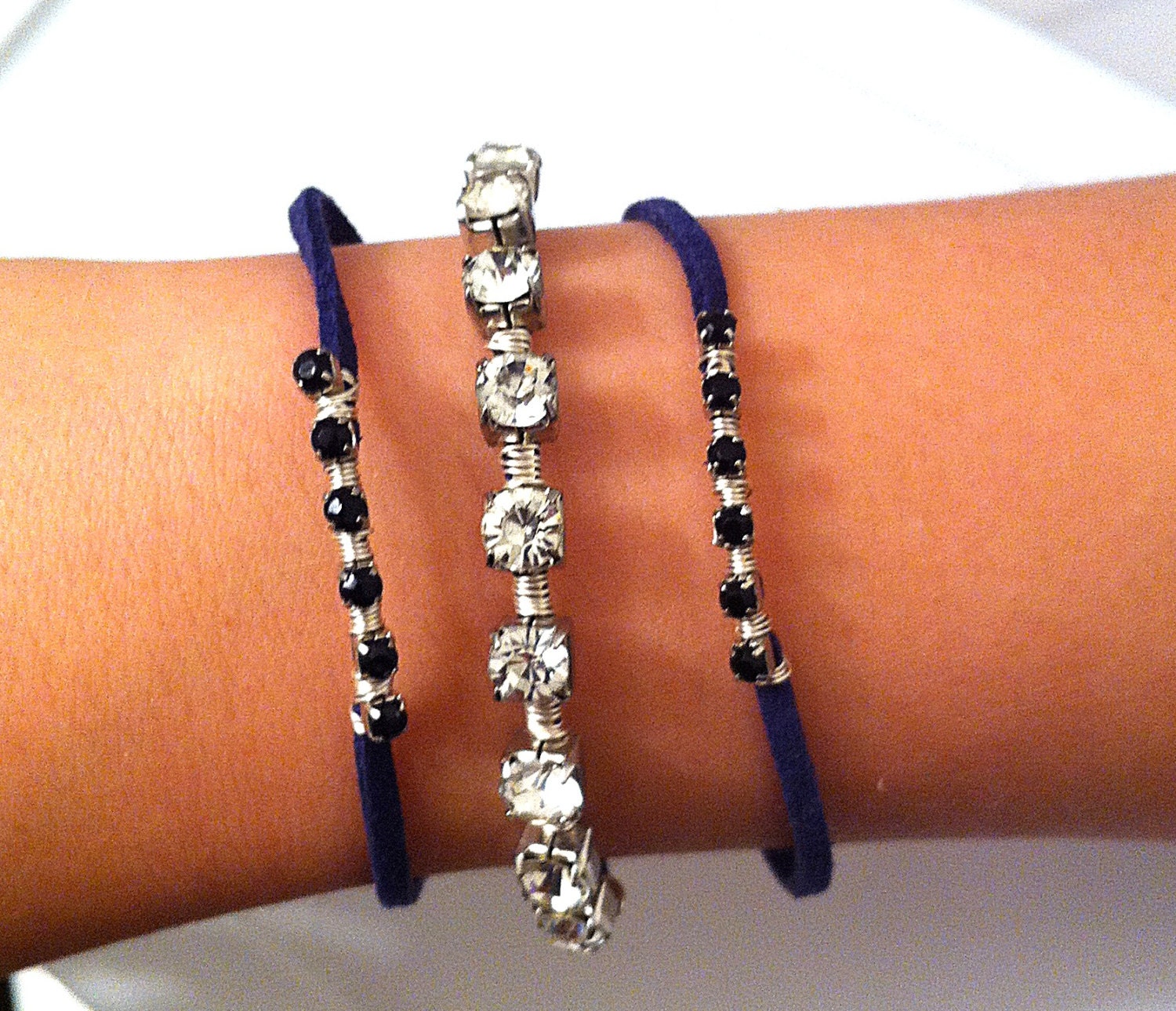 Wire wrapped rhinestones on navy blue leather cord stackable bracelets