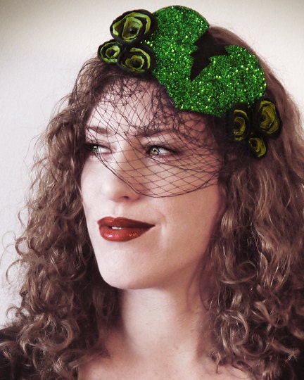 the "Zombie Heartbreaker" cocktail hat - sparkly green broken heart hat with veil and flowers