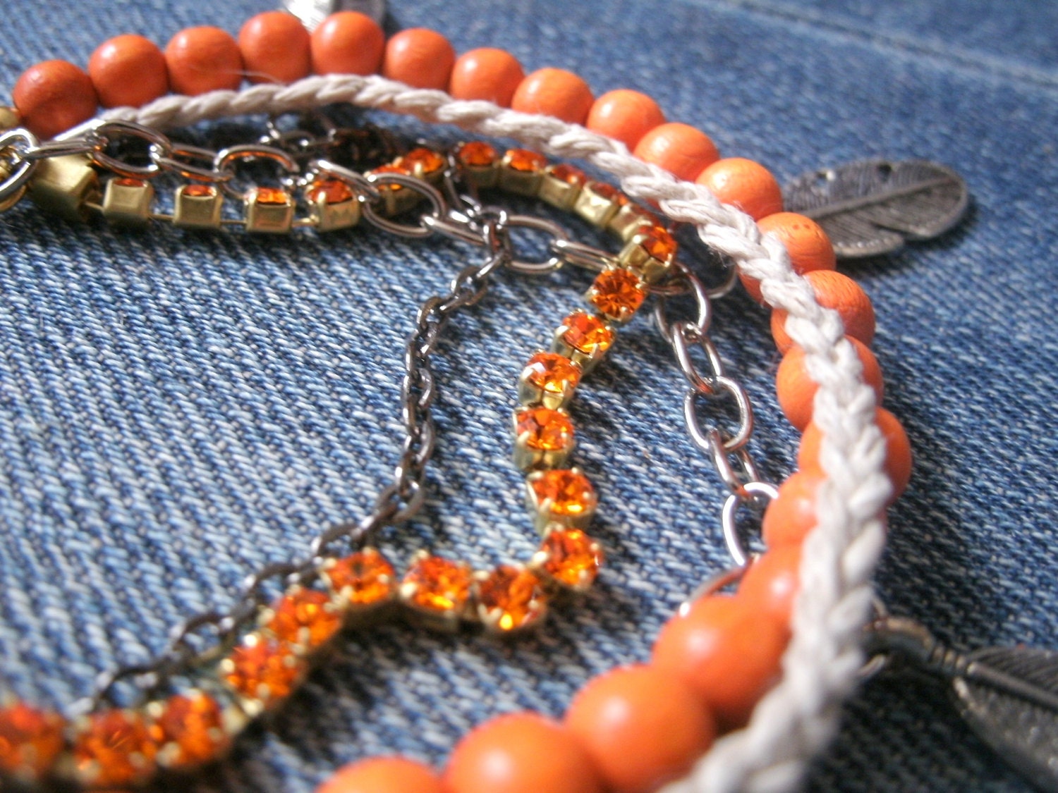 orange multi strand feather charm bracelet, handmade, one of a kind / bohemian jewelry