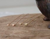 sparkly golden arrow necklace in rose gold color and yellow gold color
