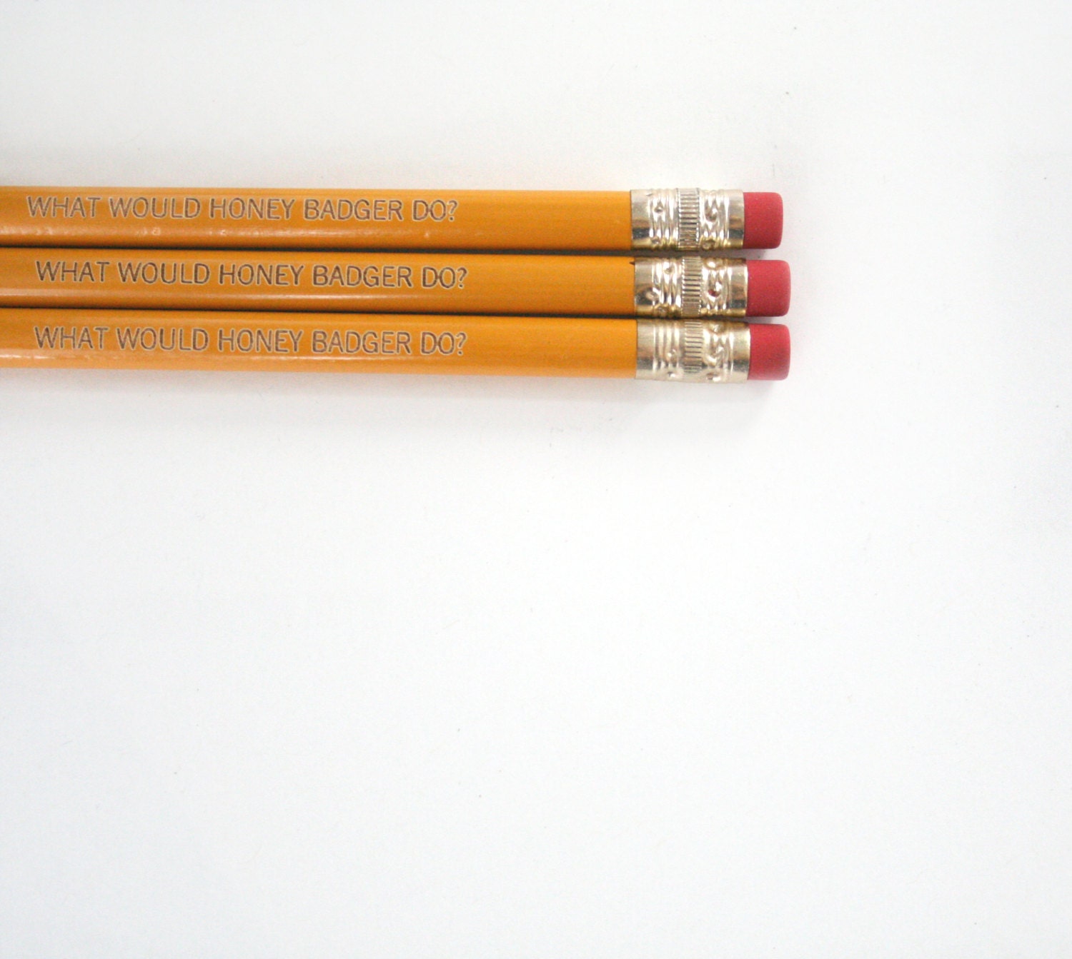 what would honey badger do pencil set 3 three engraved mustard yellow pencils. honey badger.