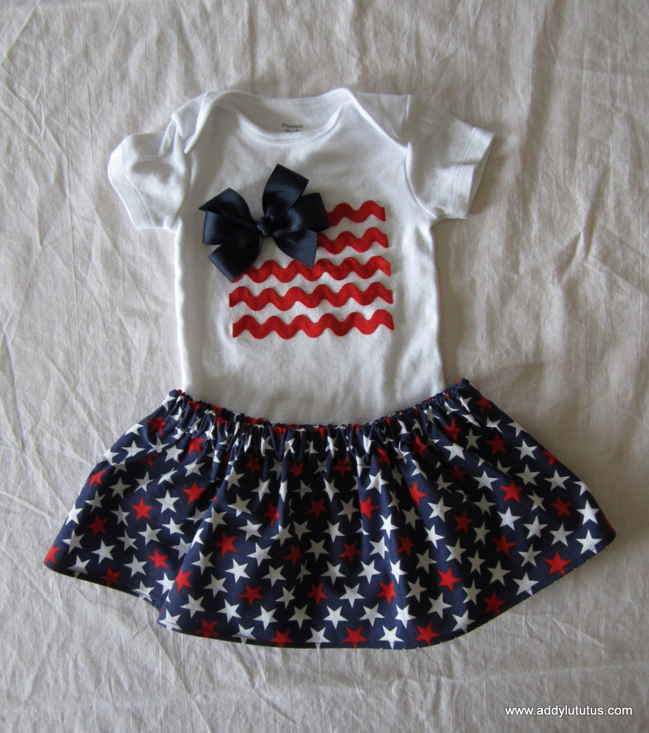 Flag applique onsie with coordinating star skirt