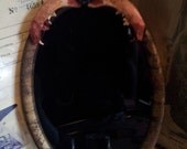 Scrying mirror antique frame and real cat mandible.