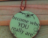 Green resin pendant necklace with quote 'become who you really are'. Large round 38mm