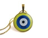 Nazar Evil Eye charm in green, 1" round antique gold pendant