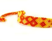 Fire Gradient Summer Friendship Bracelet - handwoven thin macrame wrist band with yellow and orange knotted string