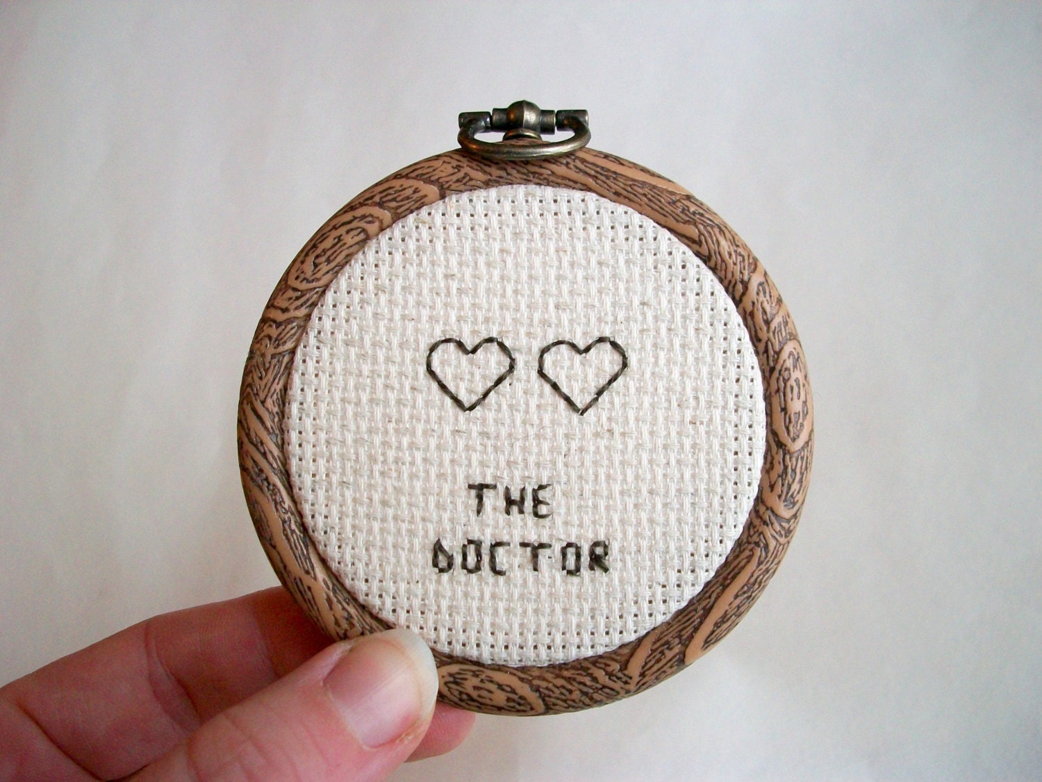 The Doctor Sign -- Modern cross stitch hobo signs for a contemporary (digital) world -- two hearted doctor
