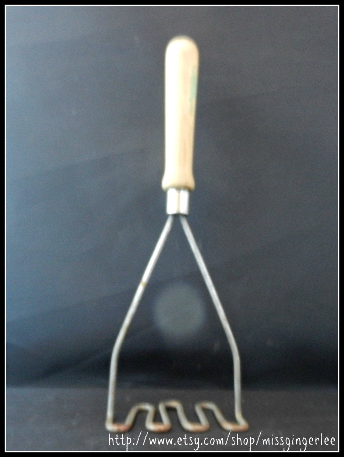 Vintage wood handled potato masher kitchen tool