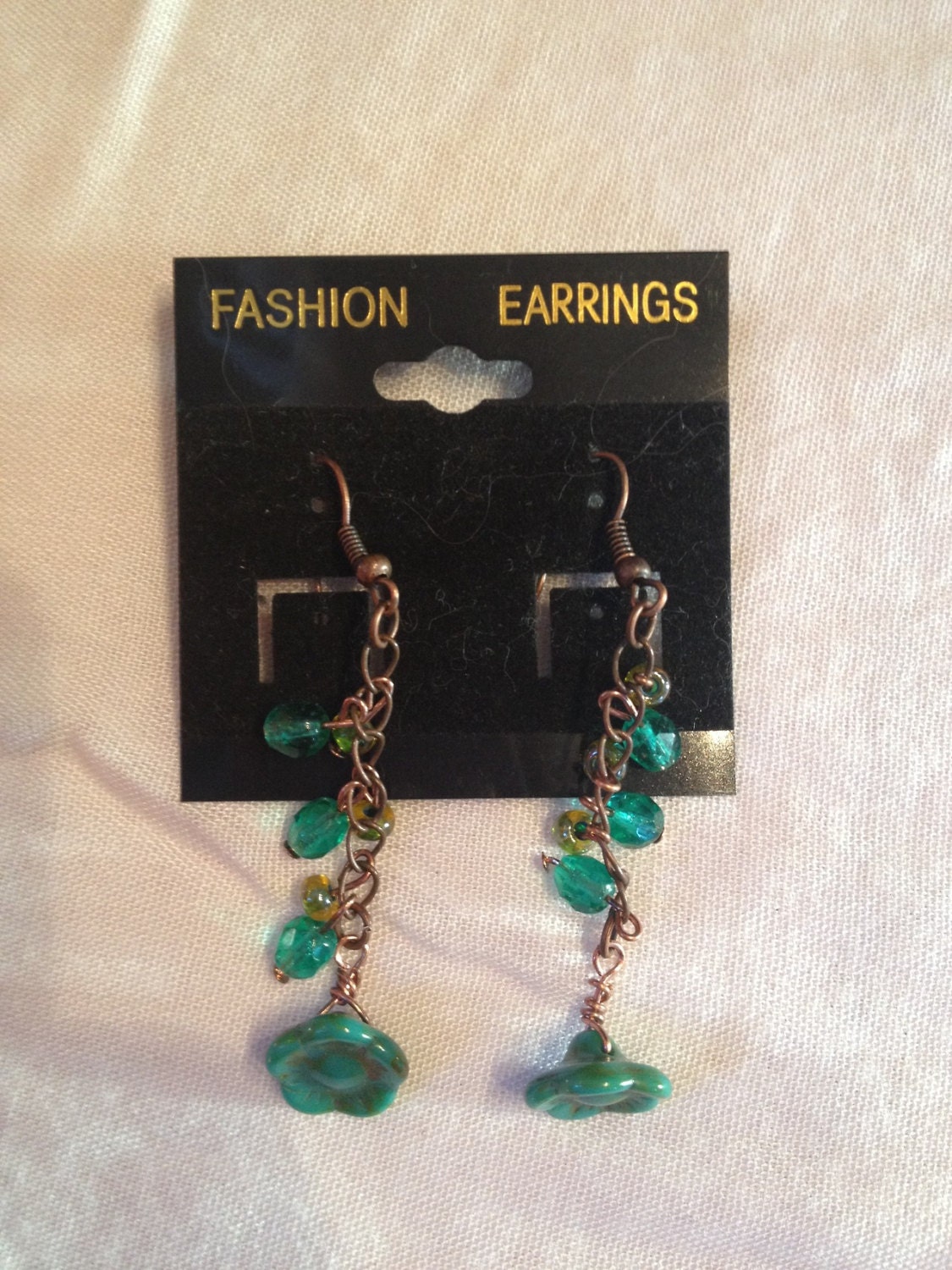 Turquoise and bronze flower dangle earrings