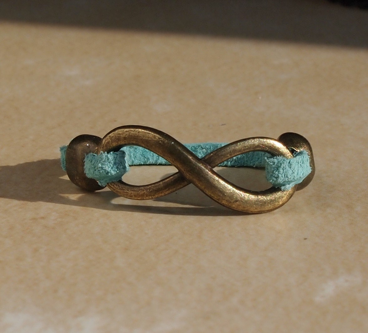 Bronze tone Infinity Ring with Leather Band made to order you pick color