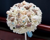 Seashell bouquet with cream roses for beach and destination wedding with light blue handle and crystal pins - TheBridalFlower Seashell bouquet with cream roses for beach and destination wedding with light blue handle and crystal pins - TheBridalFlower