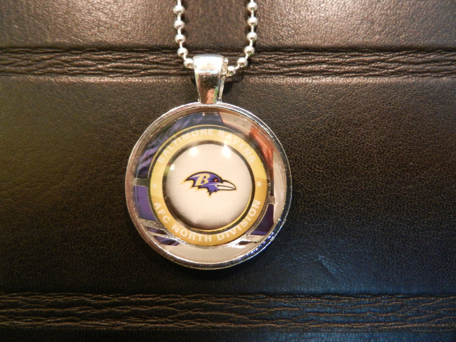 Baltimore Ravens Logo Glass Pendant In Silver Bezel, Trading Card Image