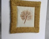 Hand Quilted Mini Wall Hanging, with fabric printed leaf centre, mounted on a 8"x 6" card