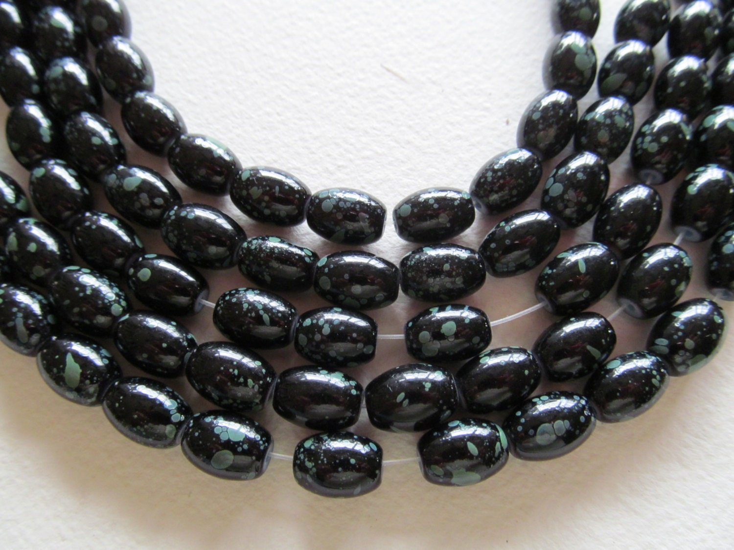 Strands of beads, oval glass beads, beading supplies