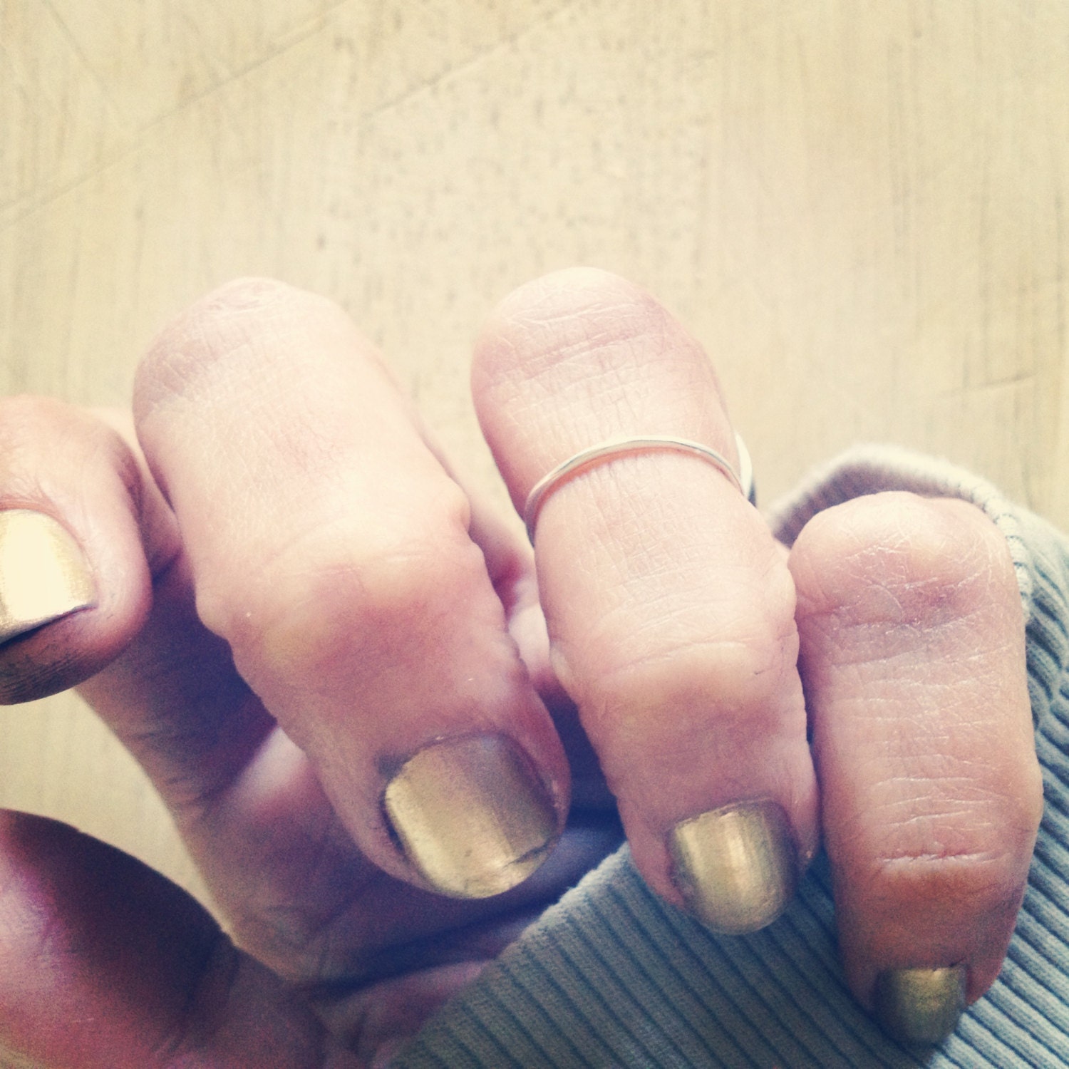 the simplest sweetest above the knuckle midfinger whisper of a ring