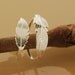 Feather Whisper Rings