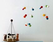 felt ball modern mobile handmade by Puka Puka light rainbow colours