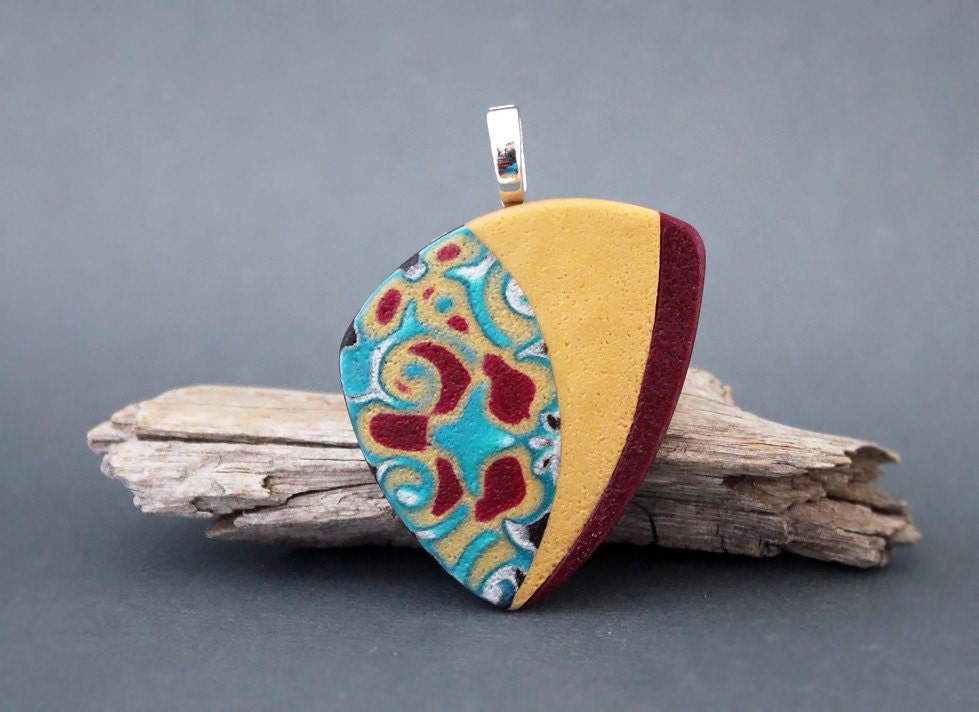 Swirly . Polymer clay pendant. Free form, asymmetrical, organic, colorful. Turquoise, gold, plum, pearl.