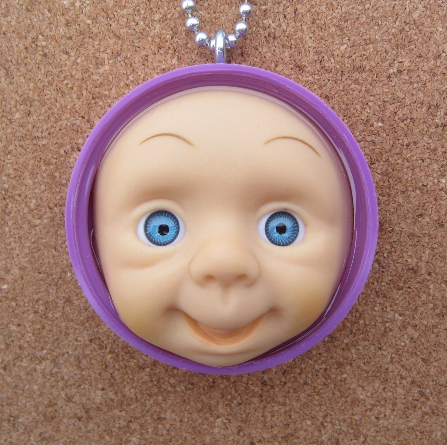 My Purple Pal - upcycled doll face pendant
