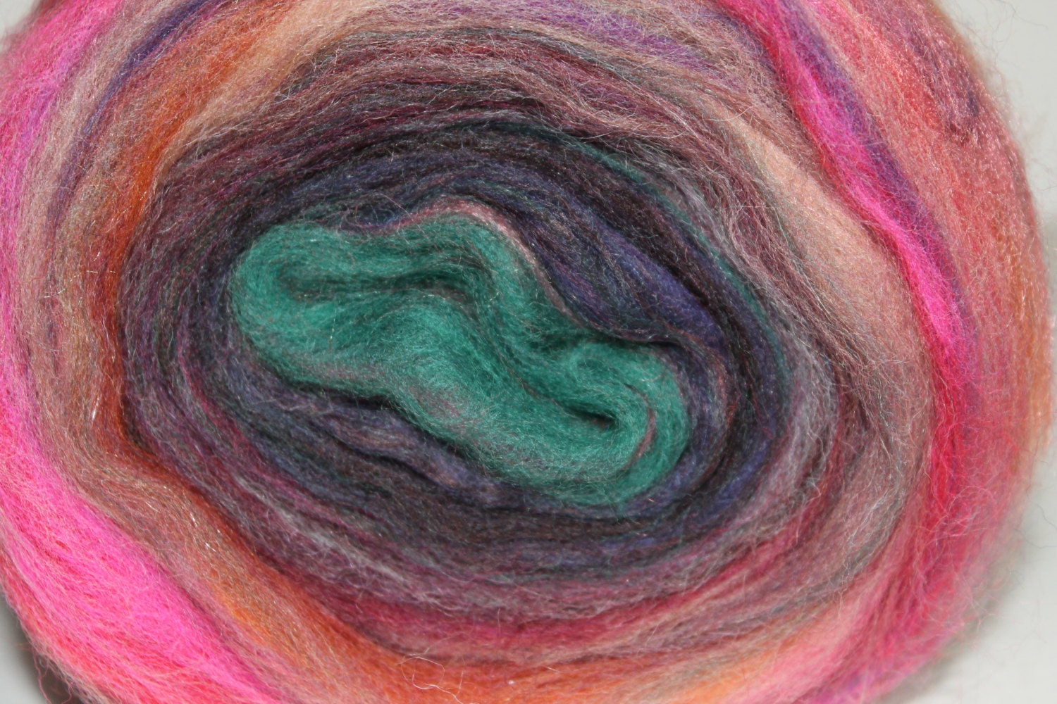 Merino wool blended center pull roving.  Motley Crue 3.  4.8oz