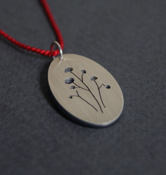 Seed Pods, a layered silhouette pendant