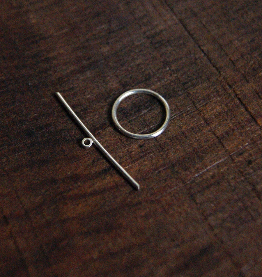 Seed Pods, a layered silhouette pendant