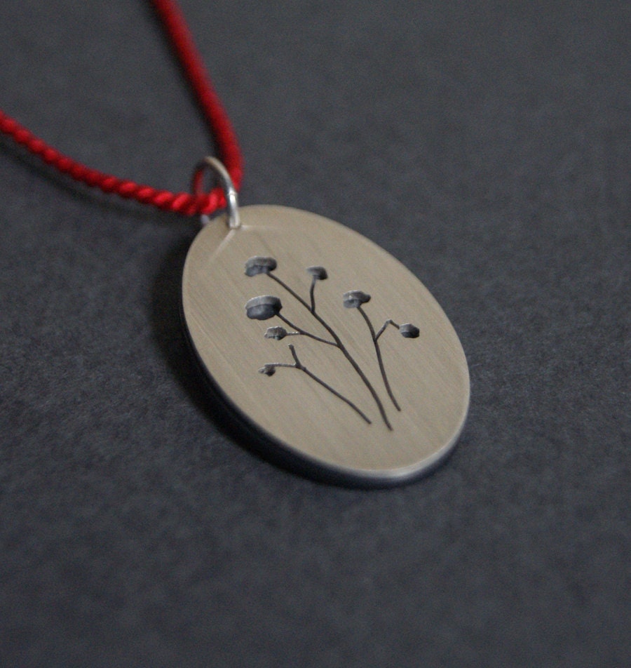 Seed Pods, a layered silhouette pendant