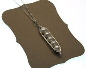 sterling silver pea pod necklace with five peas