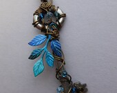 Blue Leaves Key Pendant -- Wire Wrapped Key with Multicolored Blue Leaves, Antique Brass Wire, Blue Swarovski crystals