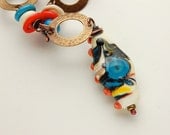 Ivory and Turquoise Lampwork Bead with Coral and Brass Necklace