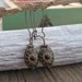 Gorgeous carved black and gold earrings,antique looking, on long ear wires
