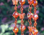Iridescent Tangerine Orange Suncatcher with Copper Wrapped Marble Prisms and Glass Butterflies